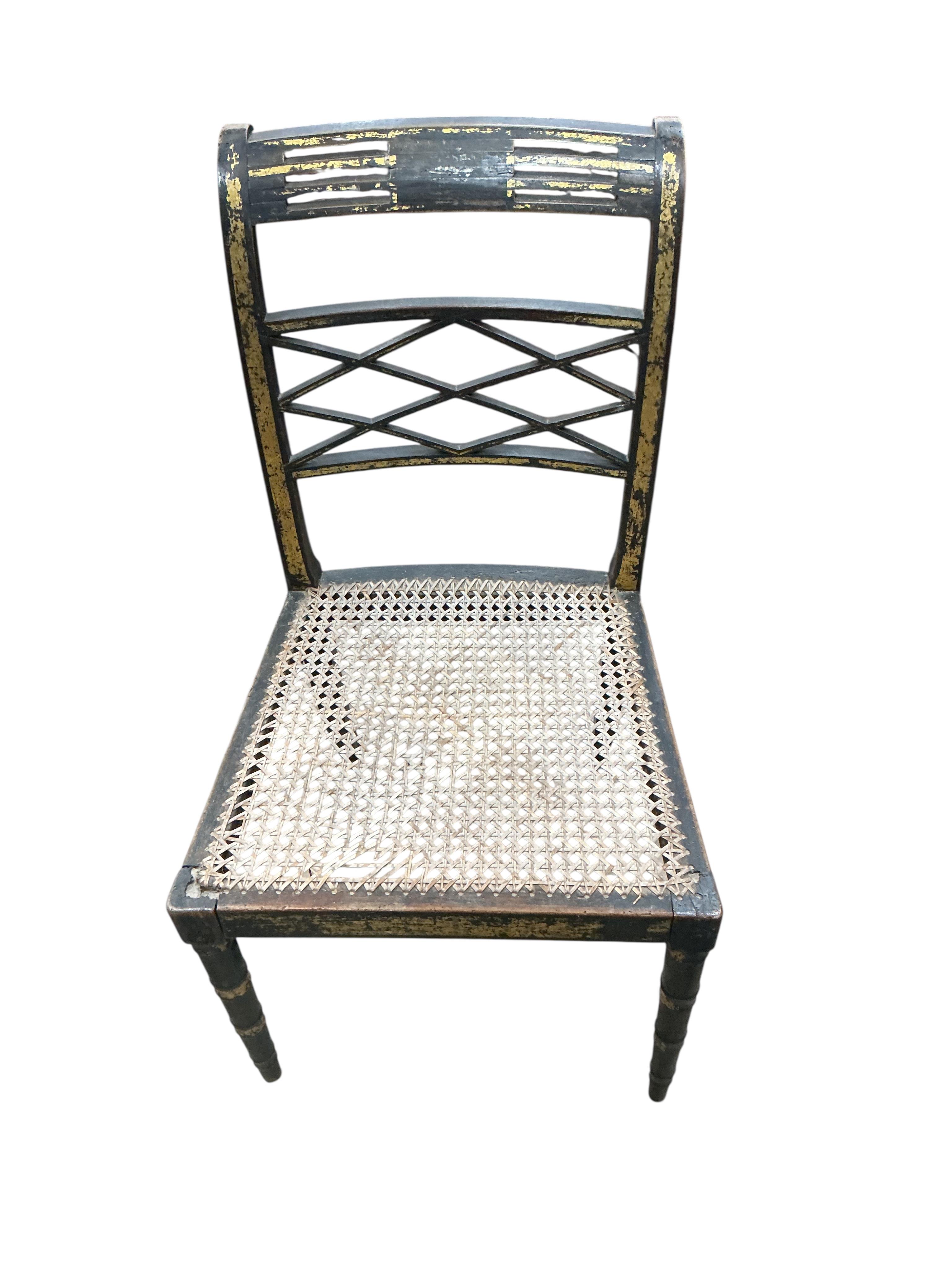 A set of four Regency ebonised cane seat dining chairs, width 46cm, depth 42cm, height 86cm